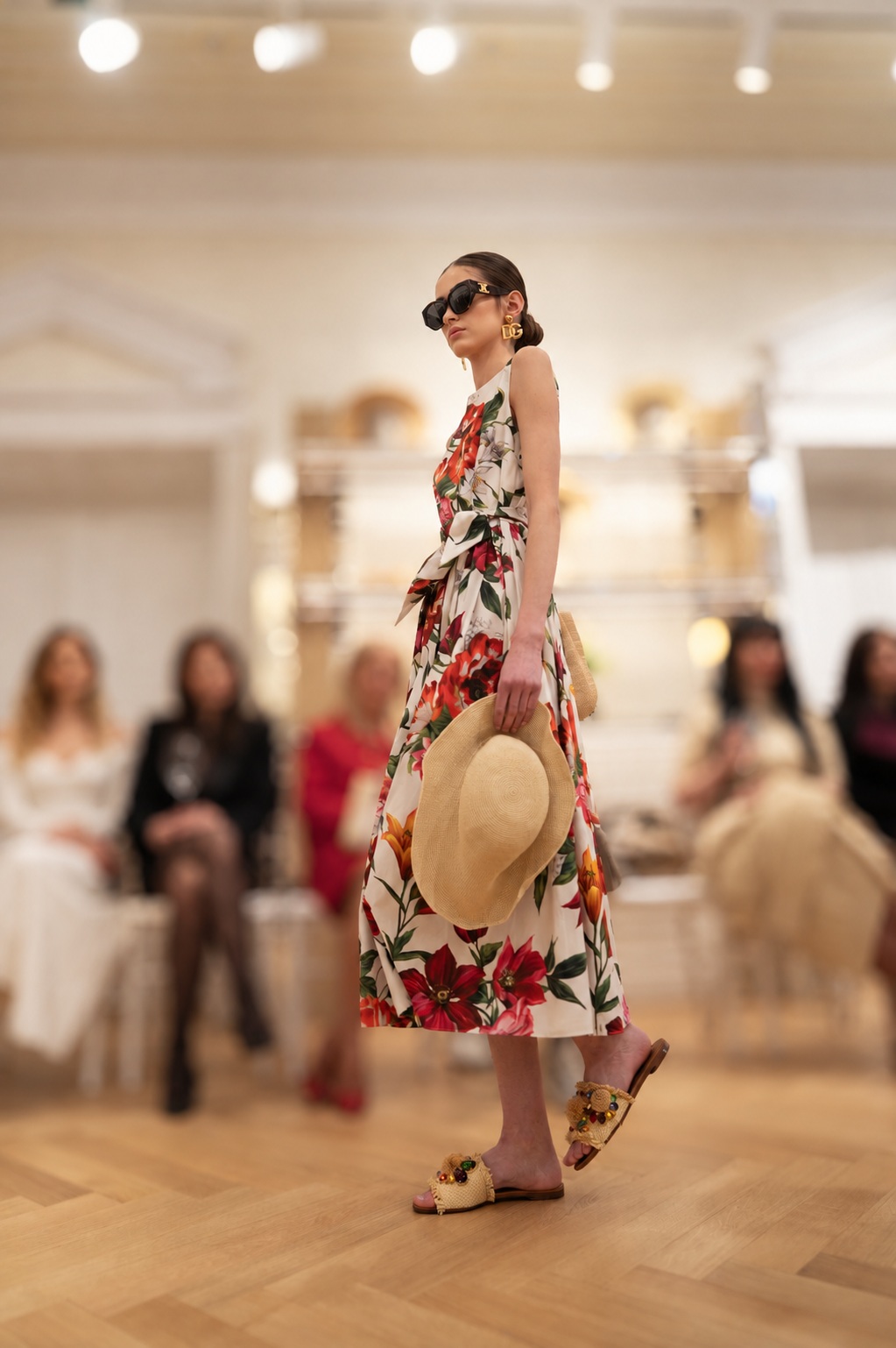 Side view of a model with a low bun wearing a floral dress