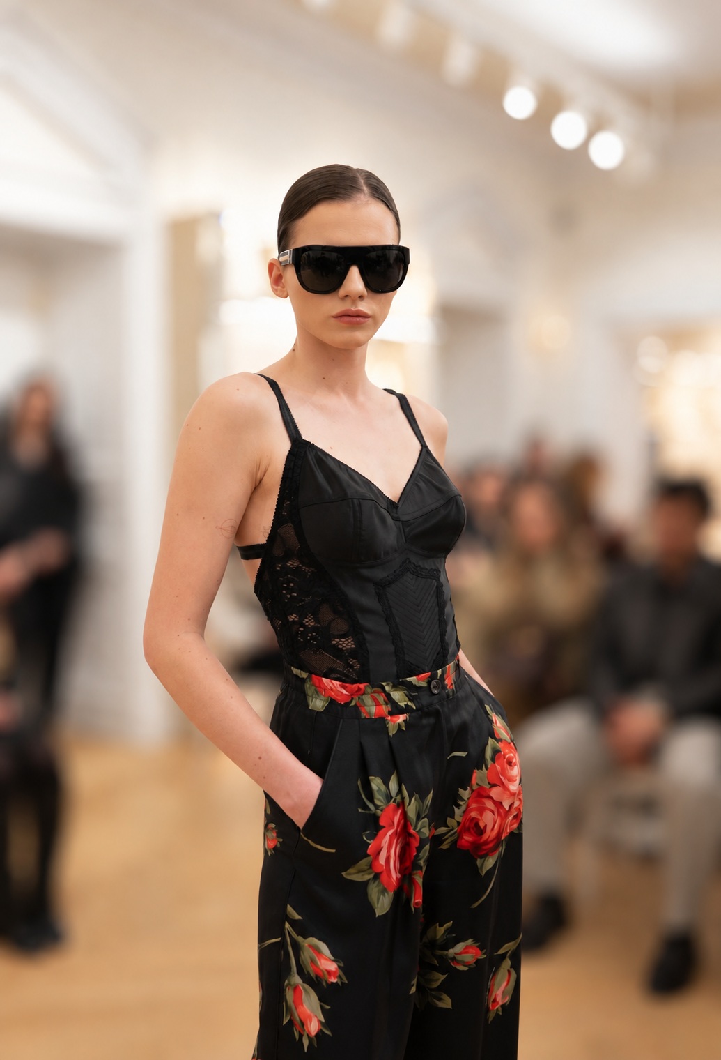 Model in black with polished swept-back hair