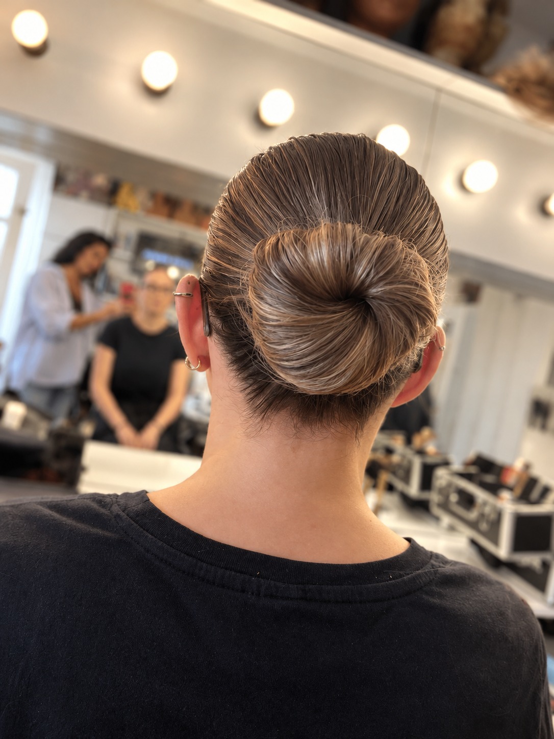 A smooth classic low bun